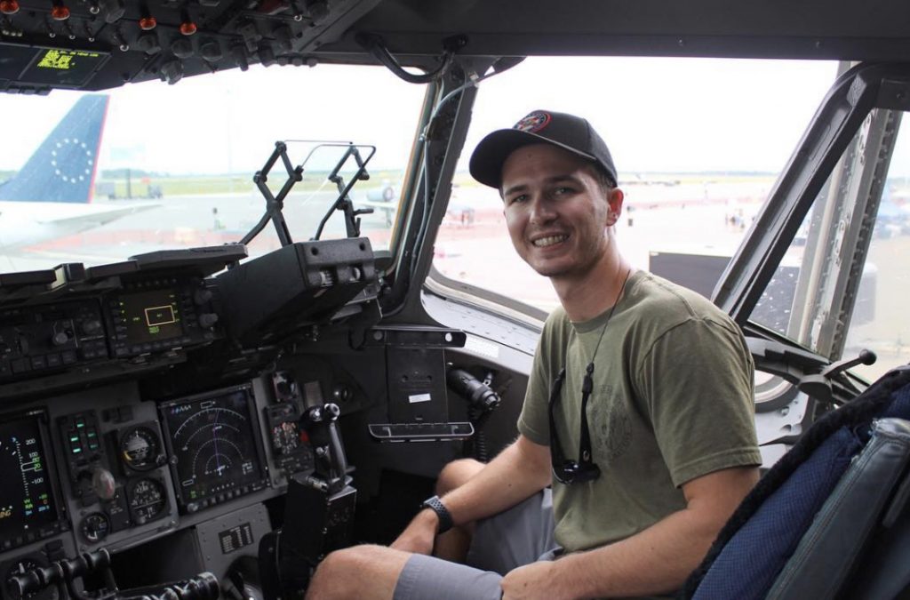 Hunter Maxwell poses in the right seat of an aircraft.